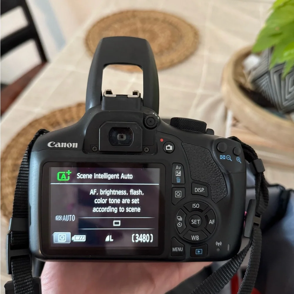 Canon Black Digital Camera with Zoom Lens (Not shown)